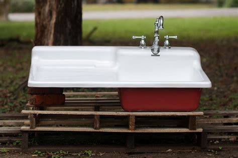 These designs below are porcelain enamel on cast iron the very old school way to make these sinks. . Antique cast iron sink with drainboard for sale
